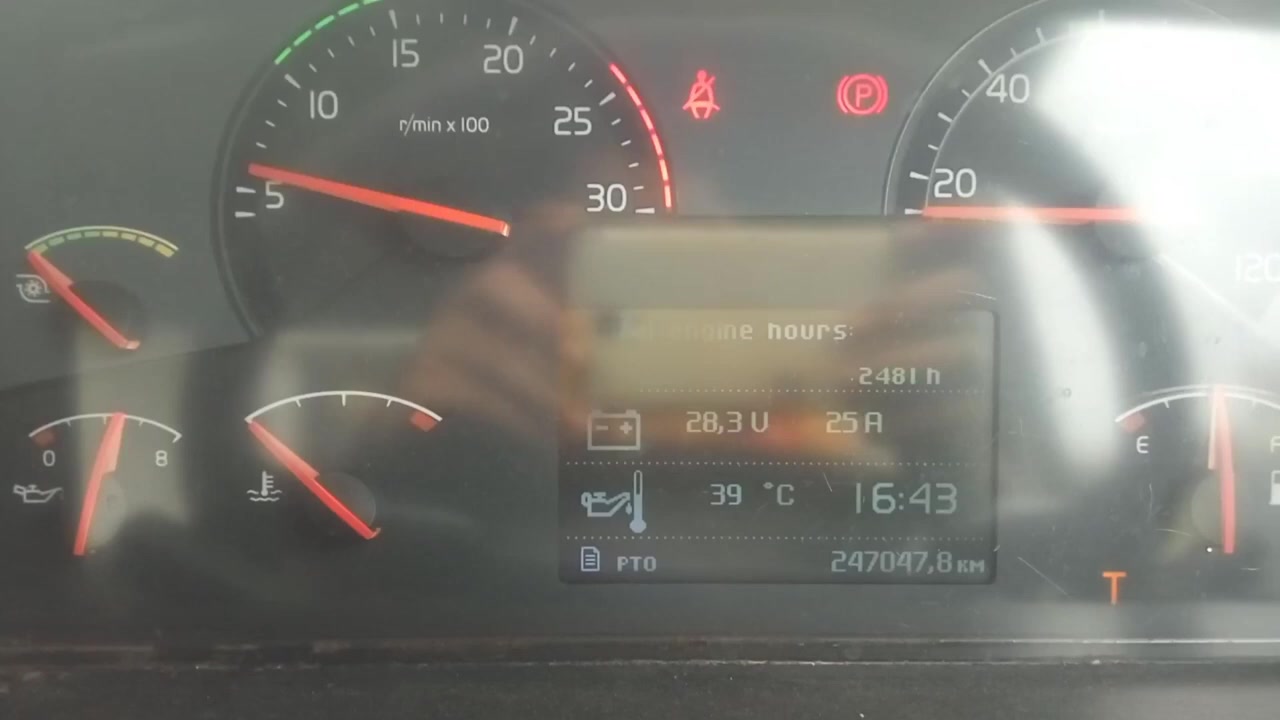 Volvo truck dashboard showing engine RPM at idle (around 500 RPM) and other vehicle data.