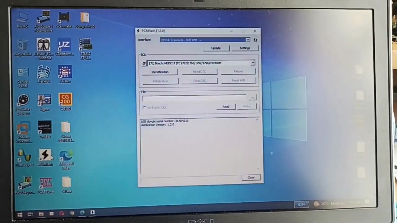 PCMFlash software interface open on the laptop, showing ECU selection and read/write options.