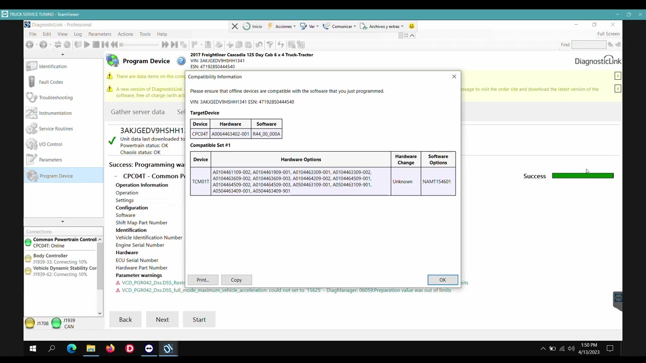 A 'Success' message indicating programming completion, along with a 'Compatibility Information' window.